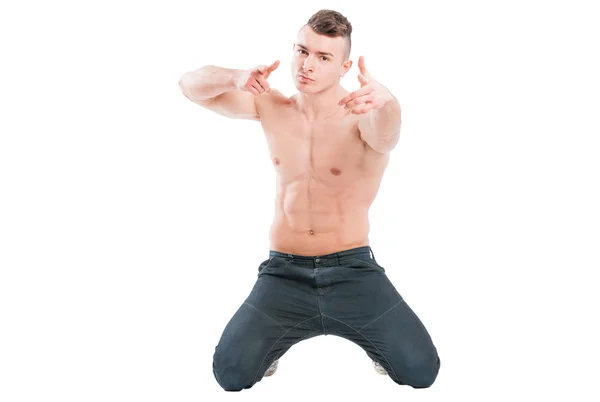 Confident muscular male model on his knees — Stock Photo, Image