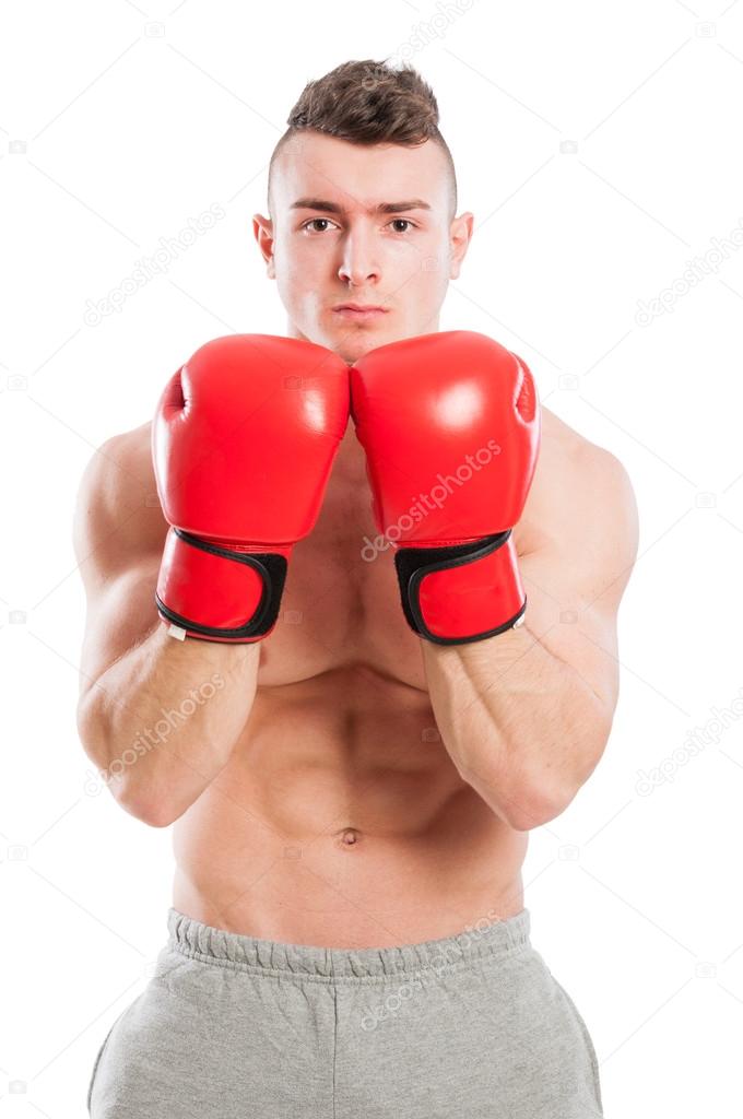 Muscular and fit boxing trainer