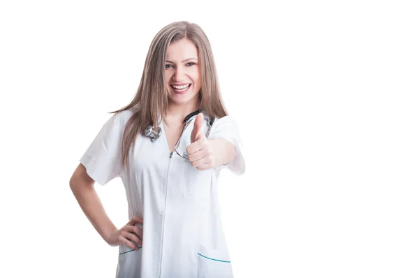 Young and beautiful female doctor showing thumbs up — Stock Photo, Image