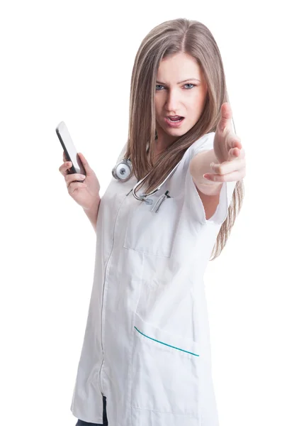 Female doctor making shoot gesture — Stock Photo, Image