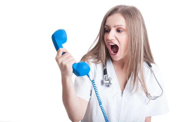 Woman doctor shouting at the phone — Stock Photo, Image