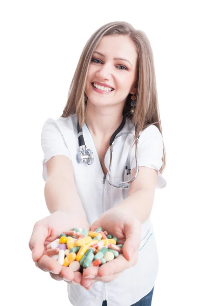 Young woman doctor offering pills — Stock Photo, Image