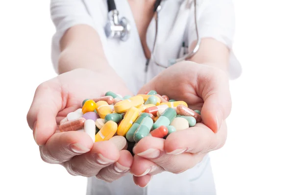 Closeup of woman hands holding pills — Stock Photo, Image