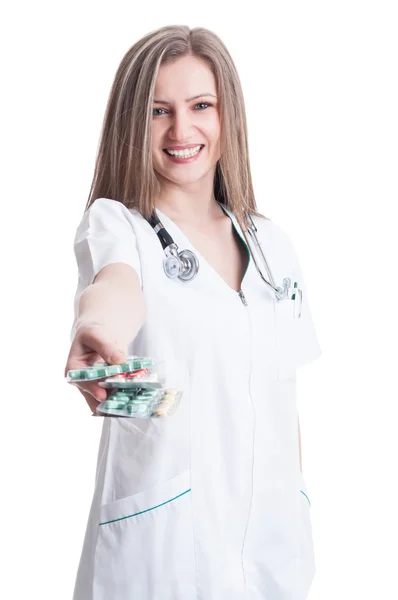 Woman doctor offering blisters of pills — Stock Photo, Image