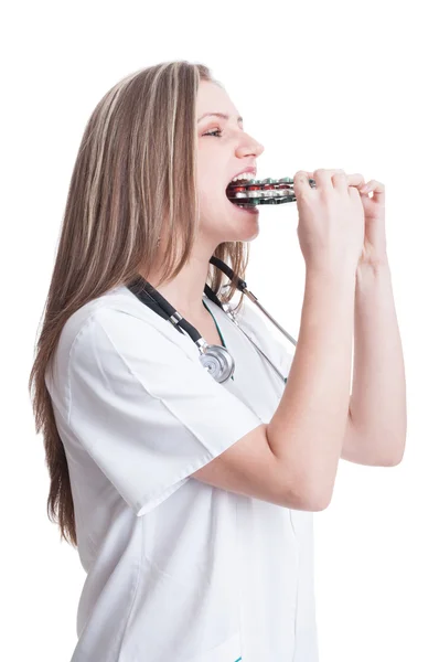 Woman doctor taking a bunch a pills — Stock Photo, Image