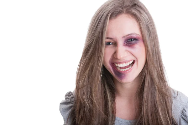 Beaten woman laughing — Stock Photo, Image