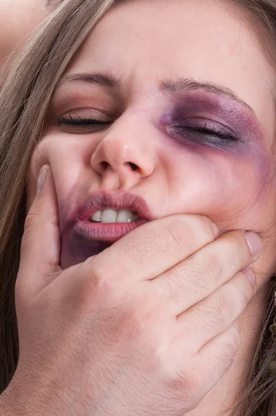 Scared woman getting beaten by aggressive man — Stock Photo, Image