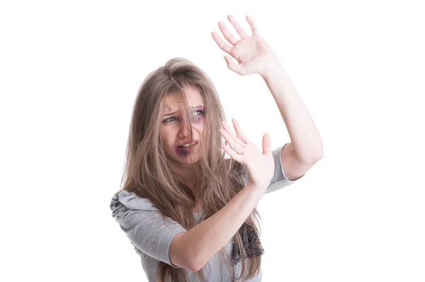Abused and scared woman protecting herself — Stock Photo, Image