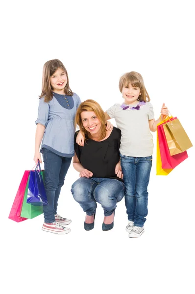 Feliz mujer de compras y sus dos hijas — Foto de Stock