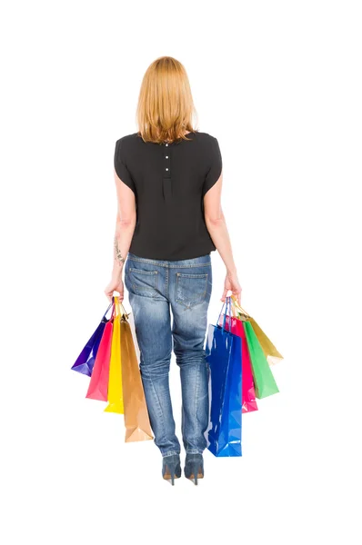 View from behind of a shopping woman walking — Stock Photo, Image