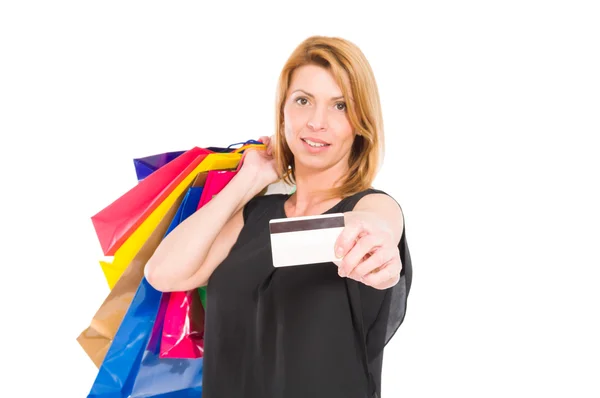 Confident shopping woman hold credit or debit card — Stock Photo, Image