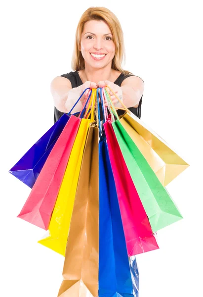 Feliz mulher de compras segurando sacos de compras — Fotografia de Stock