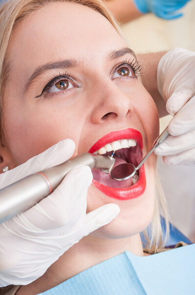 Beautiful woman having dental exam