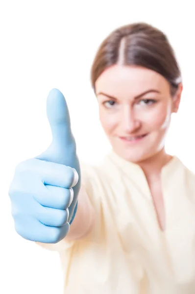 Young female doctor showing thumb up — Stock Photo, Image