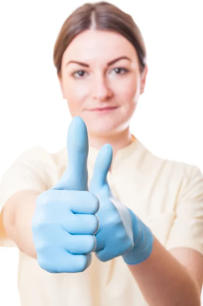 Młoda kobieta lekarz wyświetlone thumbsup — Zdjęcie stockowe