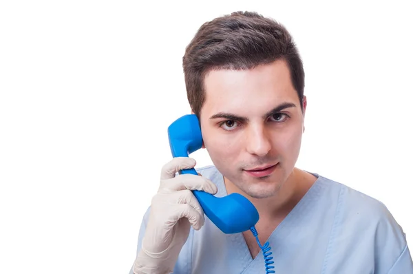 Doctor talking on wired phone — Stock Photo, Image