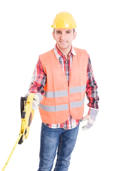 Professional builder unrolling an industrial meter reel — Stock Photo, Image