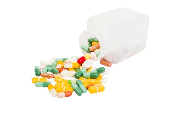 Üveg és tabletták kiömlött rakás — Stock Fotó