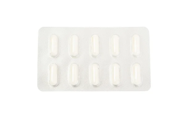 Blister z białymi tabletkami — Zdjęcie stockowe