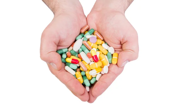 Two hands holding many pills — Stock Photo, Image