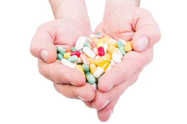 Mindkét kezével tartja csomó tabletták — Stock Fotó