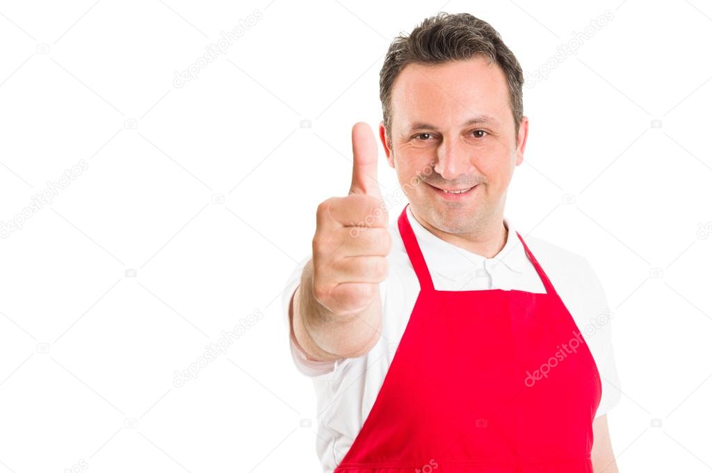 Supermarket employee showing thumbs up