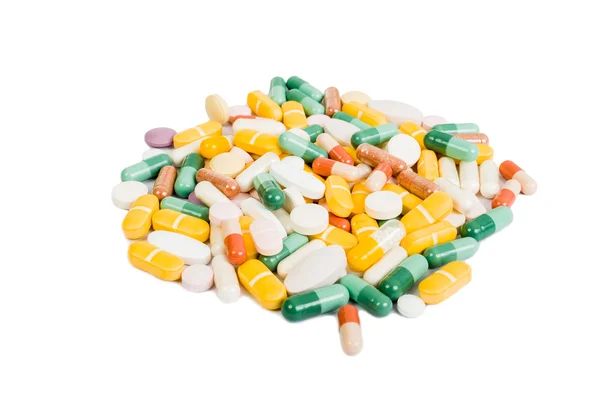 Grupo de muchas píldoras de color aisladas — Foto de Stock