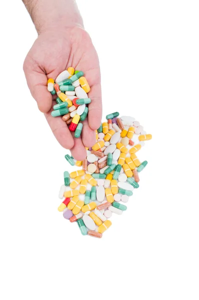 Hand holding many pills — Stock Photo, Image