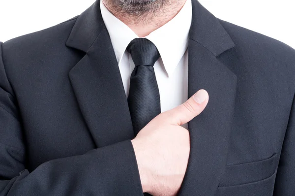 Business man inserting hand inside suit jacket — Stock Photo, Image