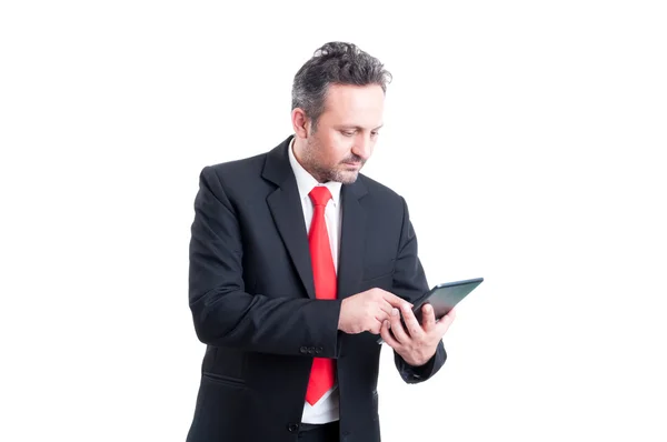 Busy business man using wireless tablet — Stock Photo, Image