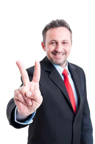 Business man showing victory sign or gesture — Stock Photo, Image