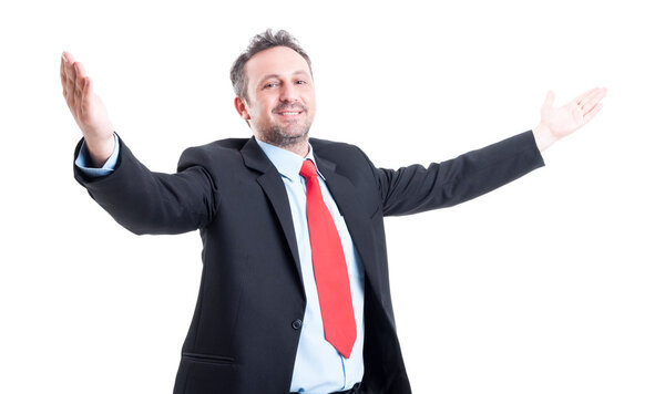 Business man with open arms looking into the camera