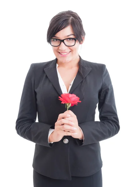 Happy business woman holding a flower — Stock Photo, Image