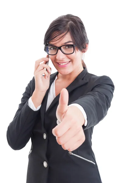 Female business manager showing like and talking on smartphone — Stock Photo, Image