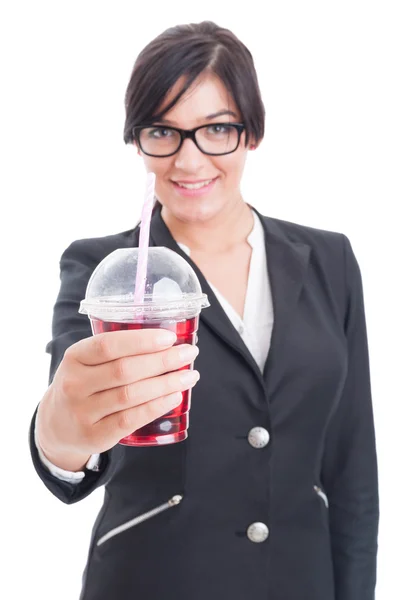 Elegant and friendly woman offering healthy red juice — Stock Photo, Image