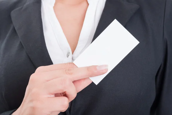 Anonymous business woman holding a blank business card — Stock Photo, Image
