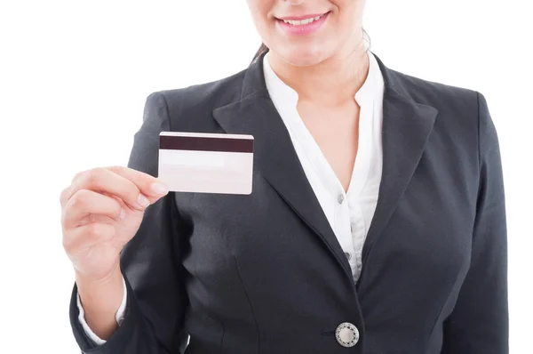 Smiling elegant woman holding a credit or debit card — Stock Photo, Image