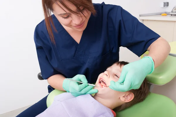 Child sitting on dentist chair