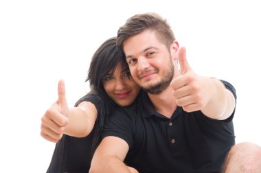 Beautiful young couple showing like or thumbs-up