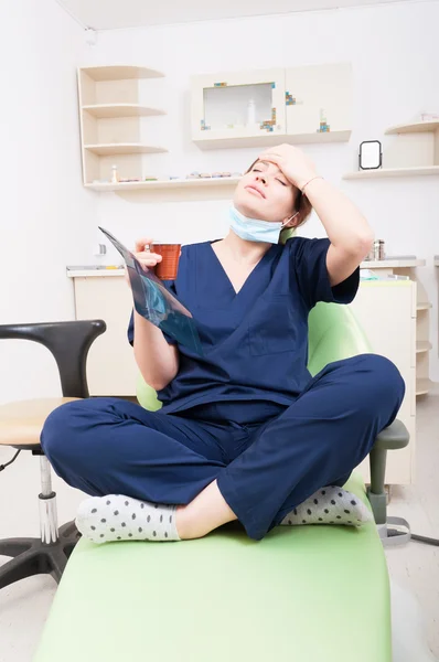 Tired dentist doctor having a headache — Stock Photo, Image