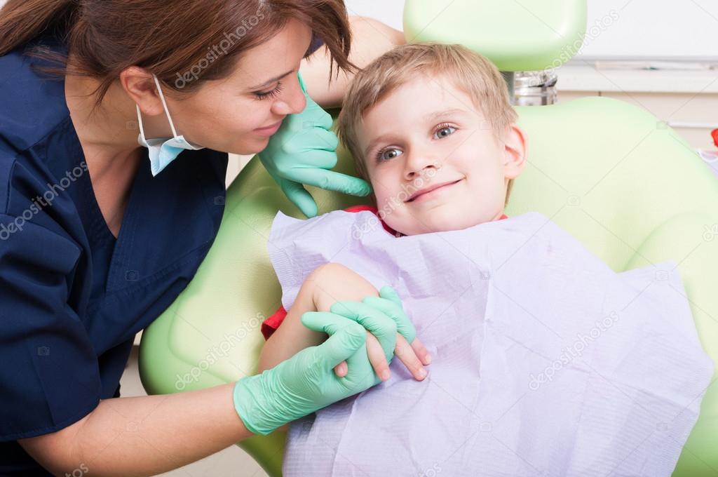 Young kid smiling in dental office