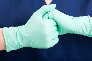 Doctor hands with gloves together