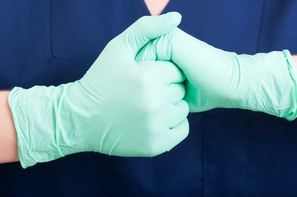 Doctor hands with gloves together — Stockfoto