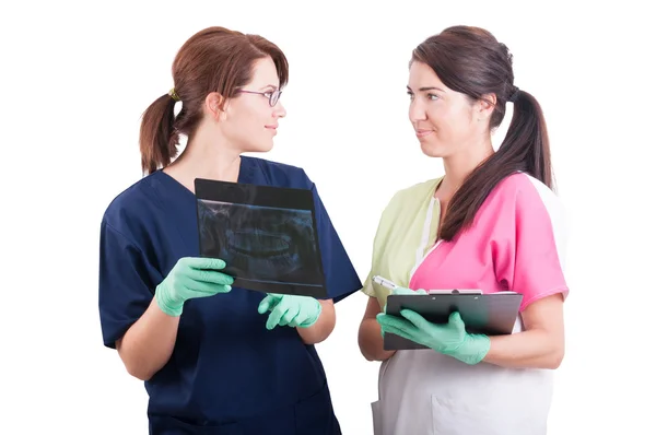 Woman dentist doctor and nurse or assistant Royalty Free Stock Images