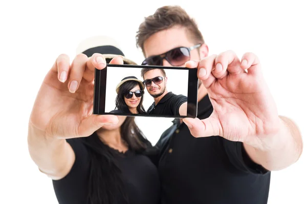 Beautiful couple taking a selfie with smartphone — ストック写真