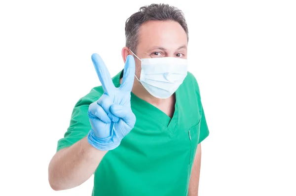 Happy doctor showing victory gesture — Stock Photo, Image