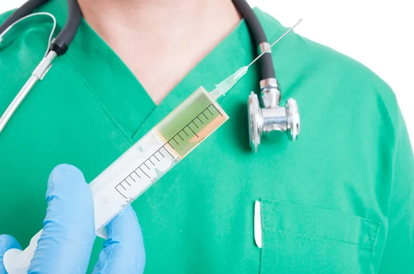 Closeup with doctor hand holding a syringe — Stock Photo, Image