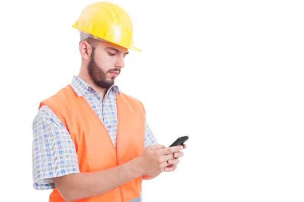 Builder or engineer texting or sending sms — Stock Photo, Image