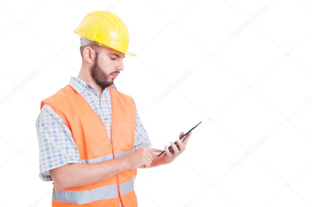 Smart and modern builder or engineer using tablet