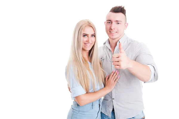 Happy couple with man showing like gesture — Stock Photo, Image
